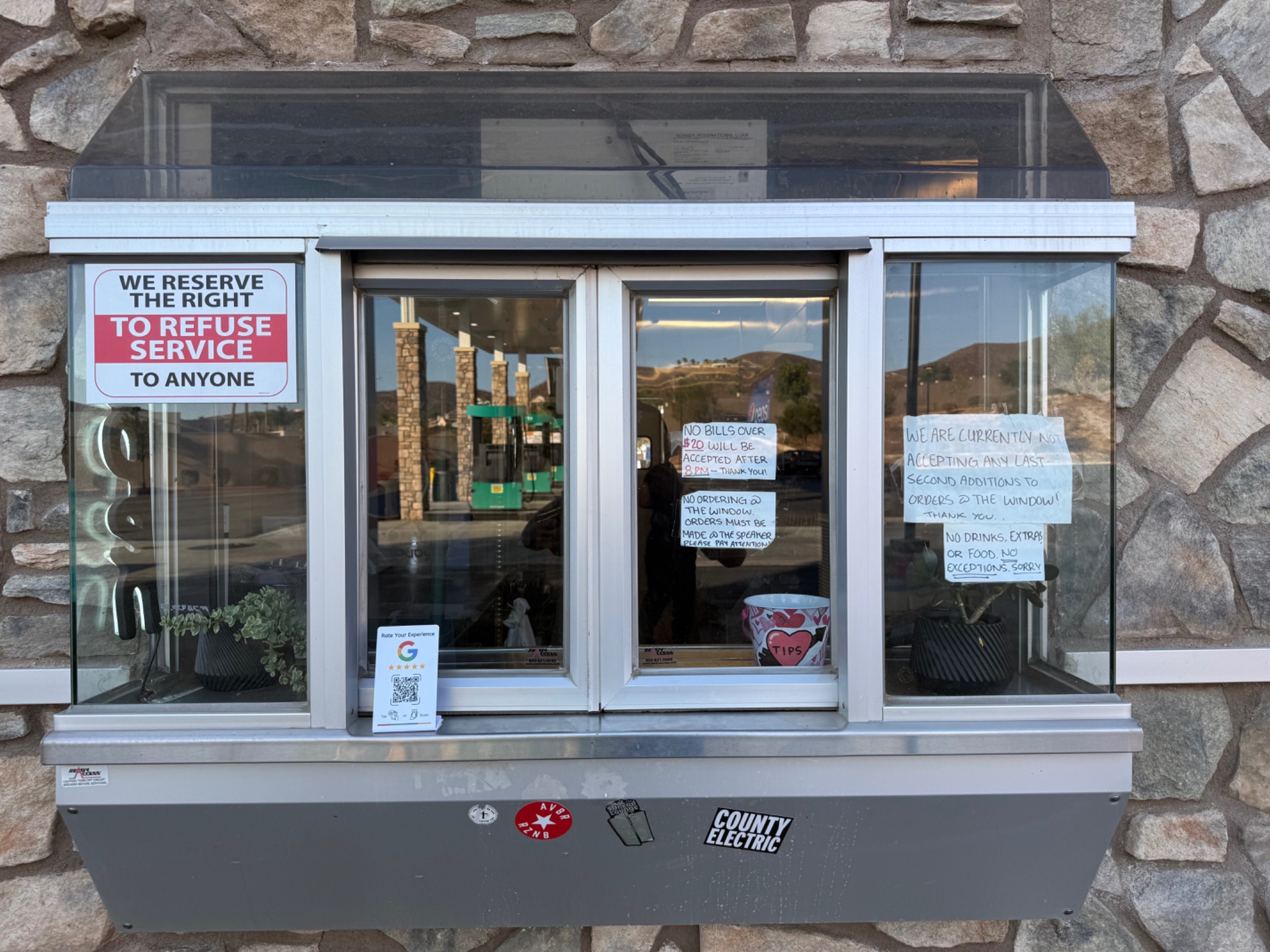 NFC Google review card installed at a restaurant service window